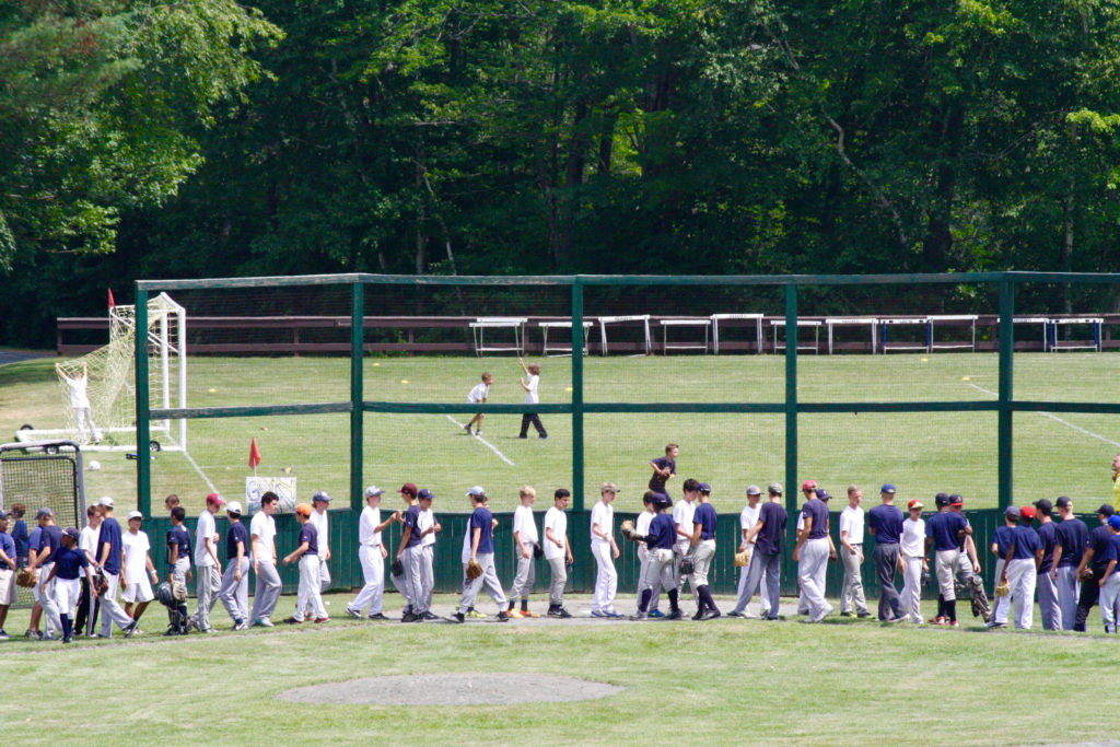 15 & Under Baseball shaking hands with Camp Tecumseh after their annual game.