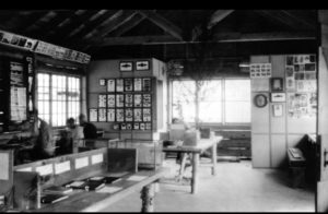 Interior of Nature Lodge Shortly after it was built (c. 1930). We still have and use the two tables with birch log legs.