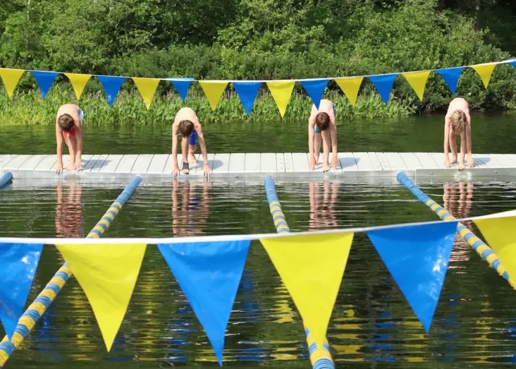 Pemi campers about to dive off the dock