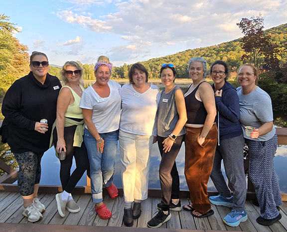 A group of women friends attending Women's Weekend at Pemi